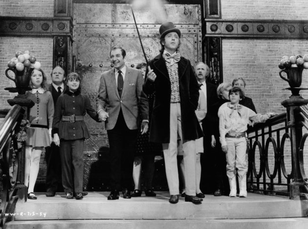 Julie Dawn Cole, Roy Kinnear, Denise Nickerson, Leonard Stone, Ursula Reit, Gene Wilder, Jack Albertson, Peter Ostrum, Paris Themmen, and Michael Bollner at top of staircase in a scene from the film 'Willy Wonka & the Chocolate Factory', 1971. (Photo by Paramount/Getty Images)
